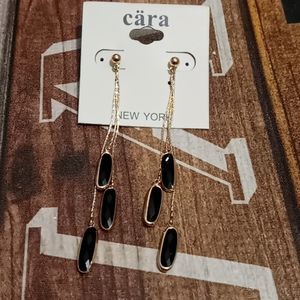 Gold and black drop long earrings.